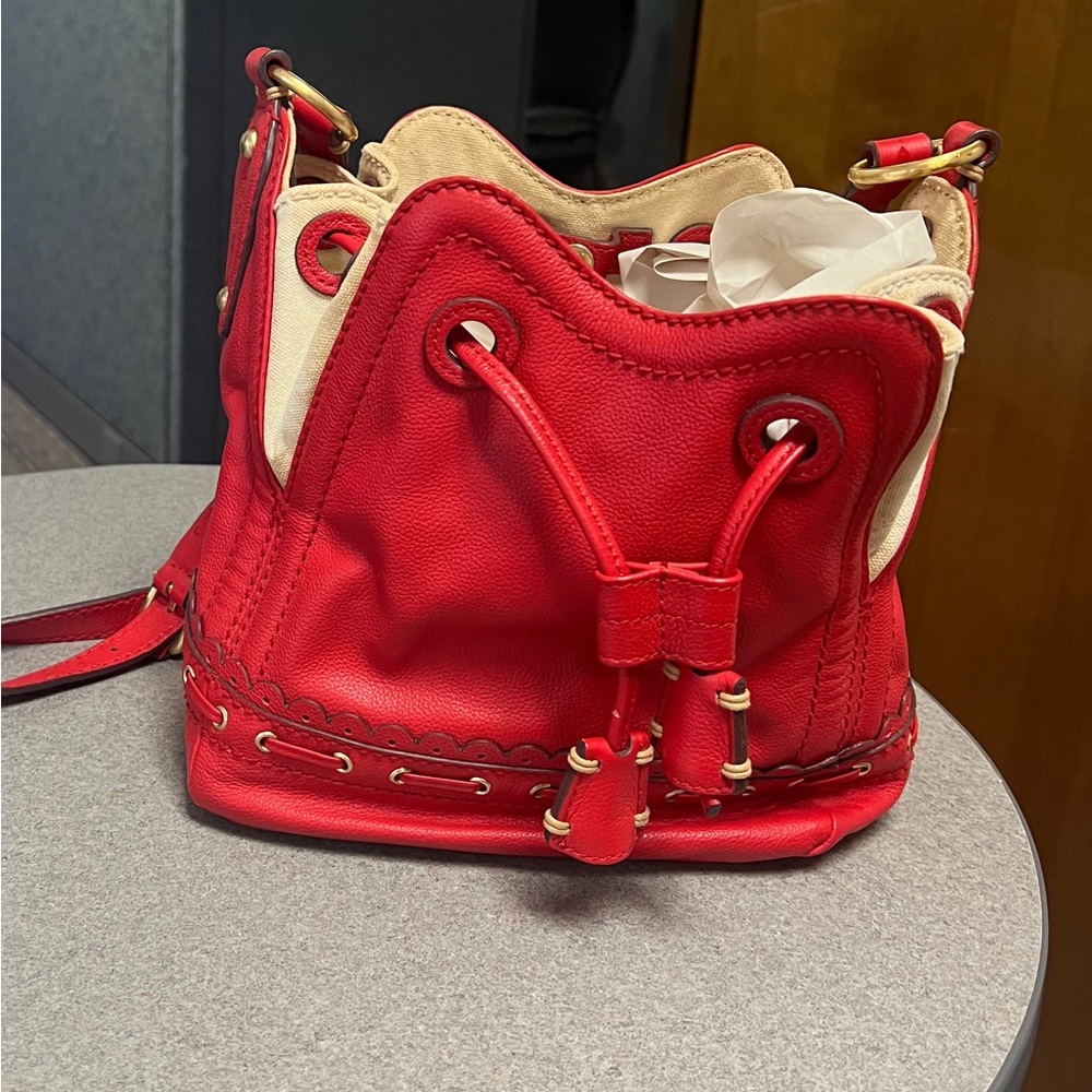 I am selling a red Italian leather bag brand new never been used